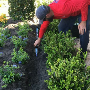 irrigation worker servicing pipes